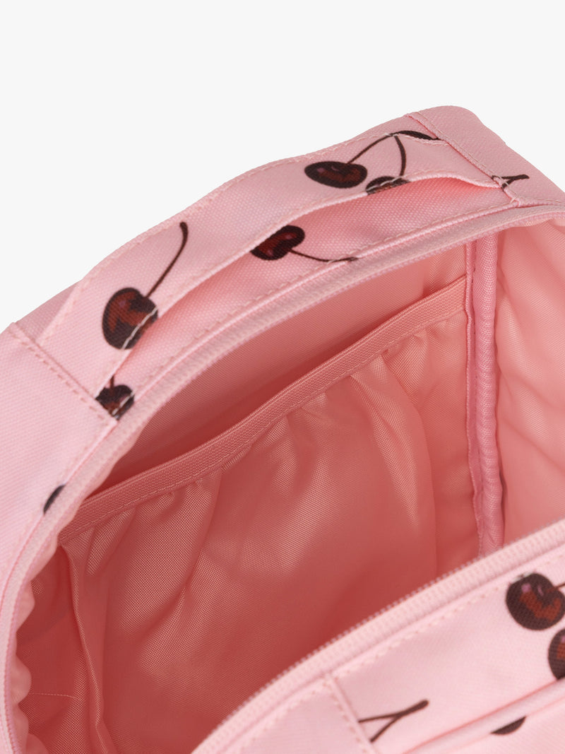 Opened view of CALPAK Everything Cube pink with cherry print Blossom Pink