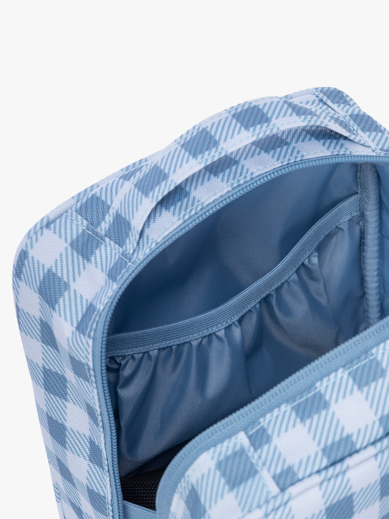 Inside pocket of CALPAK Everything Cube in light blue and white gingham print