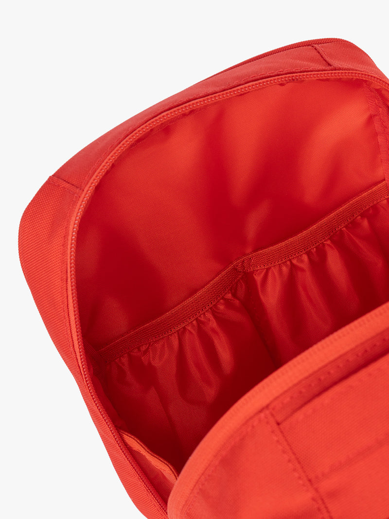 Pockets of CALPAK Everything Cube in red Tomato