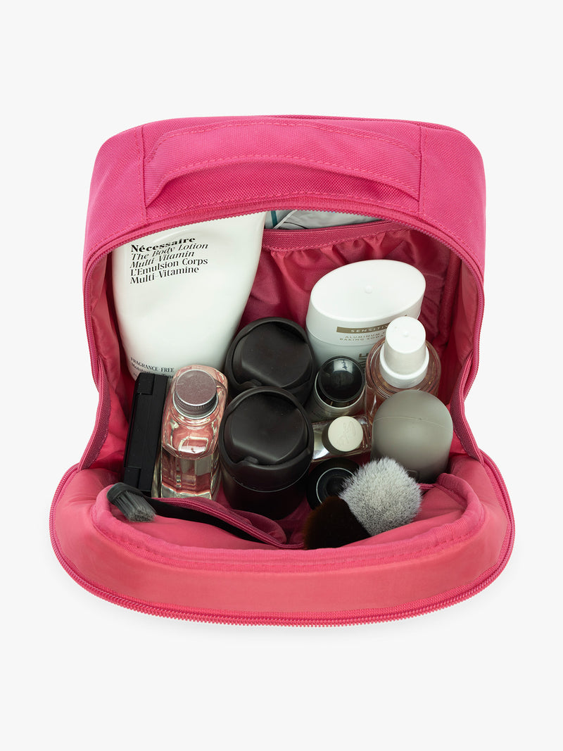 Items inside CALPAK Everything Cube in bright pink Dragonfruit