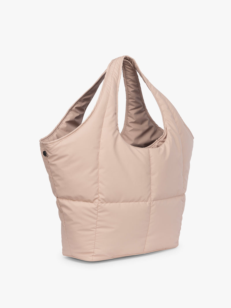 Side view of CALPAK Luka Everything Tote in light pink Rose Quartz