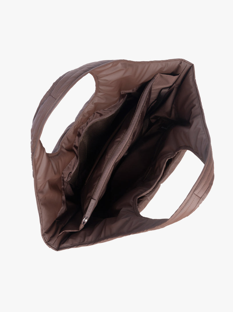 Opened view of the CALPAK Luka Everything Laptop tote in brown Walnut with shoulder strap on a white background