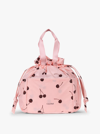 CALPAK Insulated Lunch Bag in Blossom Cherry in pink with cherry print with drawstring; ALB2001-BLOSSOM-CHERRY view 1