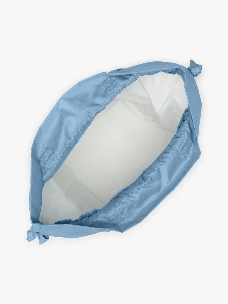 Opened CALPAK Insulated Lunch Bag in blue French Blue