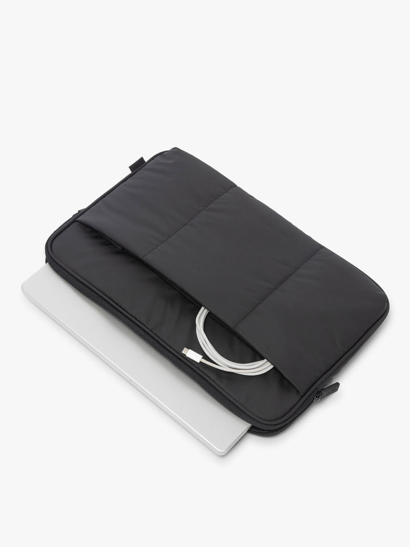 CALPAK Luka 17-in Padded Laptop Sleeve in black Matte Black with laptop and charger
