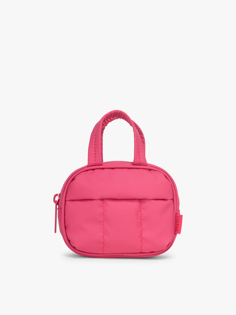 CALPAK Luka Duffel ZIp Bag Charm in bright pink Dragonfruit on a white background
