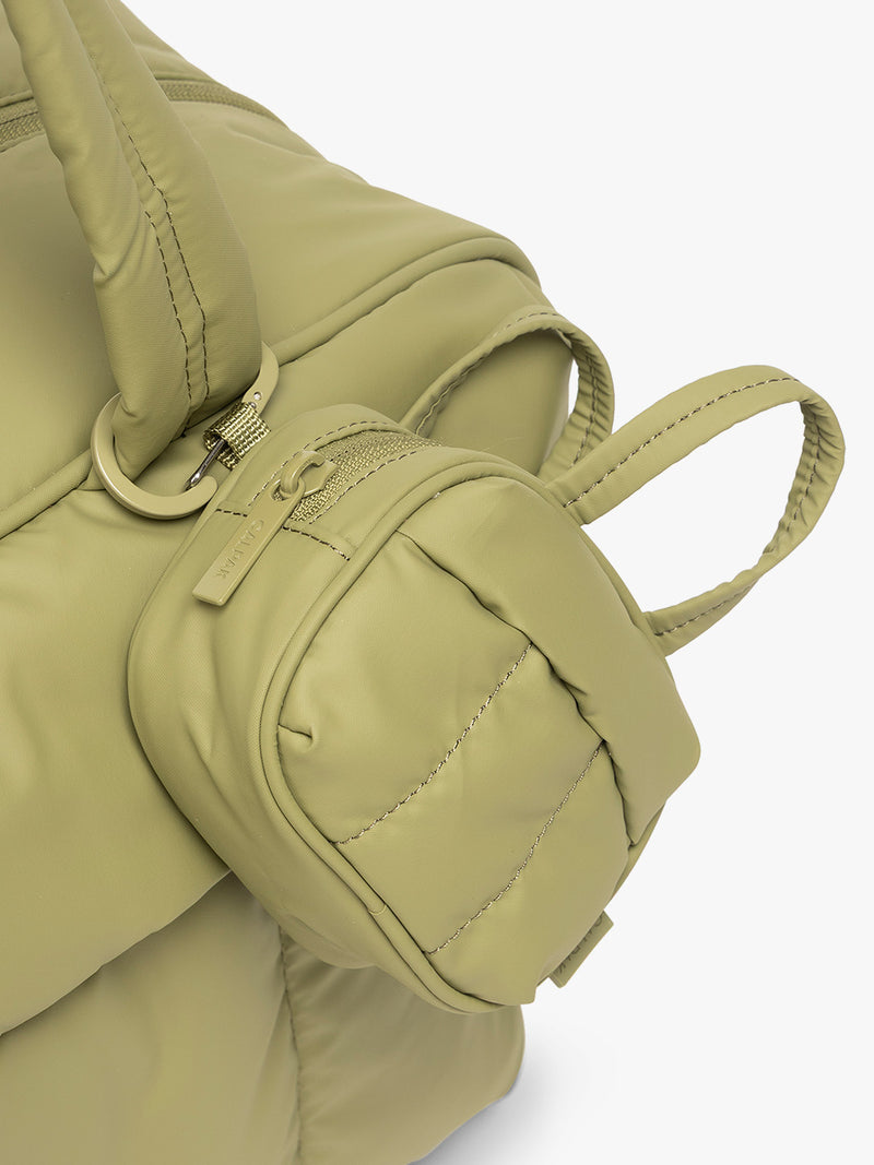 CALPAK Luka Duffel Zip Bag Charm in green Pistachio attached to bag