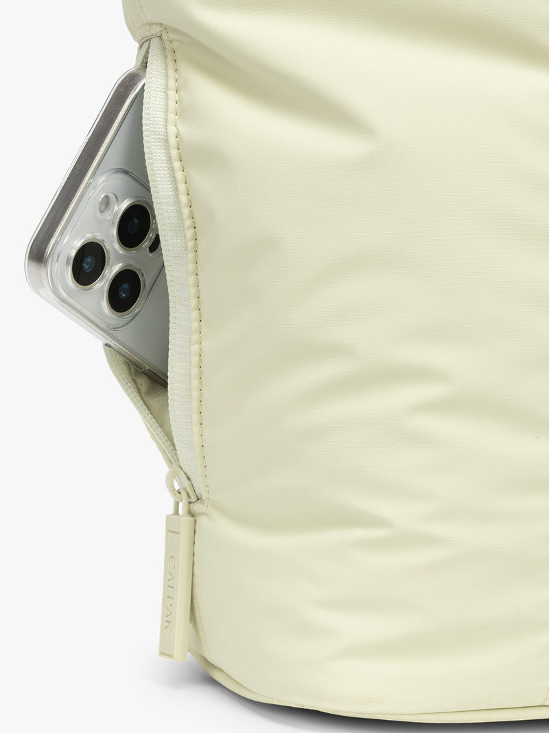 Side phone pocket of CALPAK Luka Mini Tote in light green Celadon
