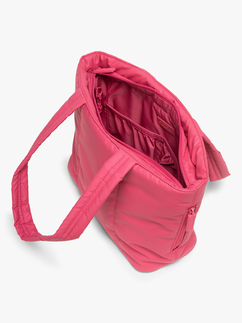 Opened view of CALPAK Luka Mini Tote in bright pink Dragonfruit on a white background