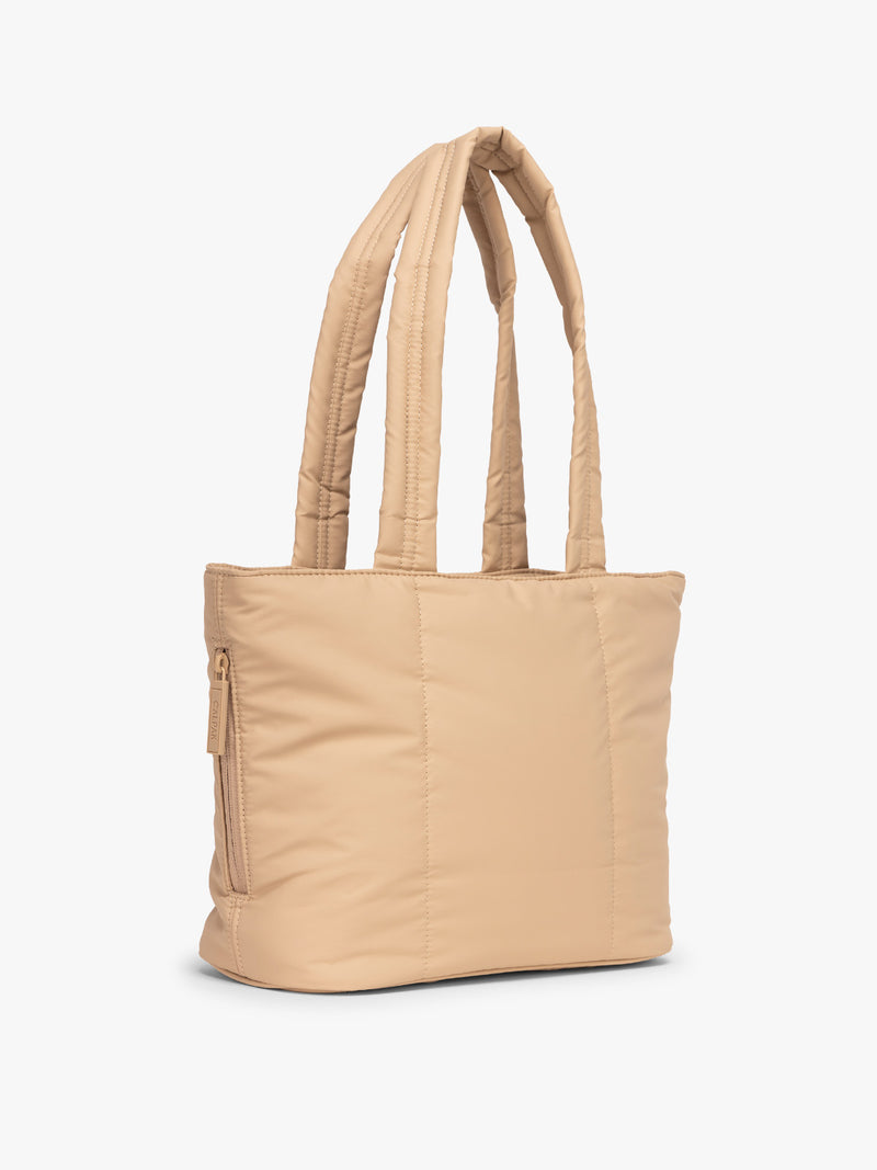 Side view of CALPAK Luka Mini Tote in beige Latte on a white background