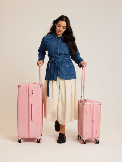CALPAK 2pc Ambeur Luggage Set featuring the Ambeur Carry-On Luggage and Ambeur Large Luggage in metallic pink Blossom with pink wheels;  LAM2000-BLOSSOM view 2