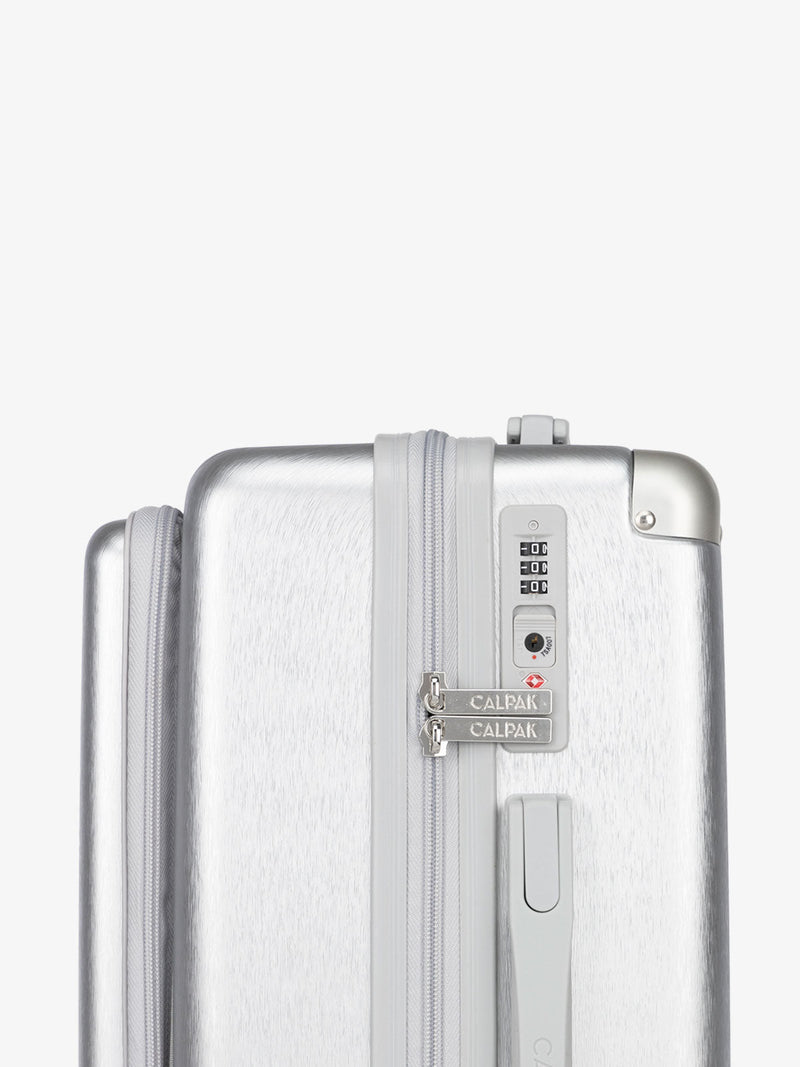 CALPAK Ambuer hardside 21 inch carry-on with front pocket and TSA lock in silver; LAM1020-FP-SILVER