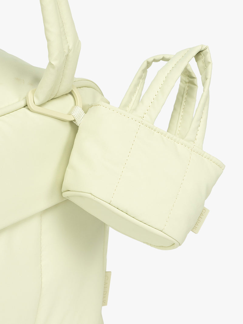 CALPAK Luka Tote Zip Bag Charm in light green Celadon with carabiner attached to bag