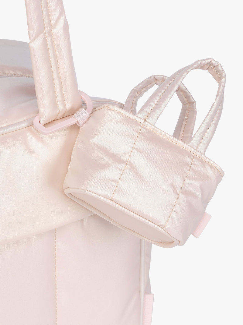 CALPAK Luka Tote Zip Bag Charm in light pink Pearlescent clipped on bag