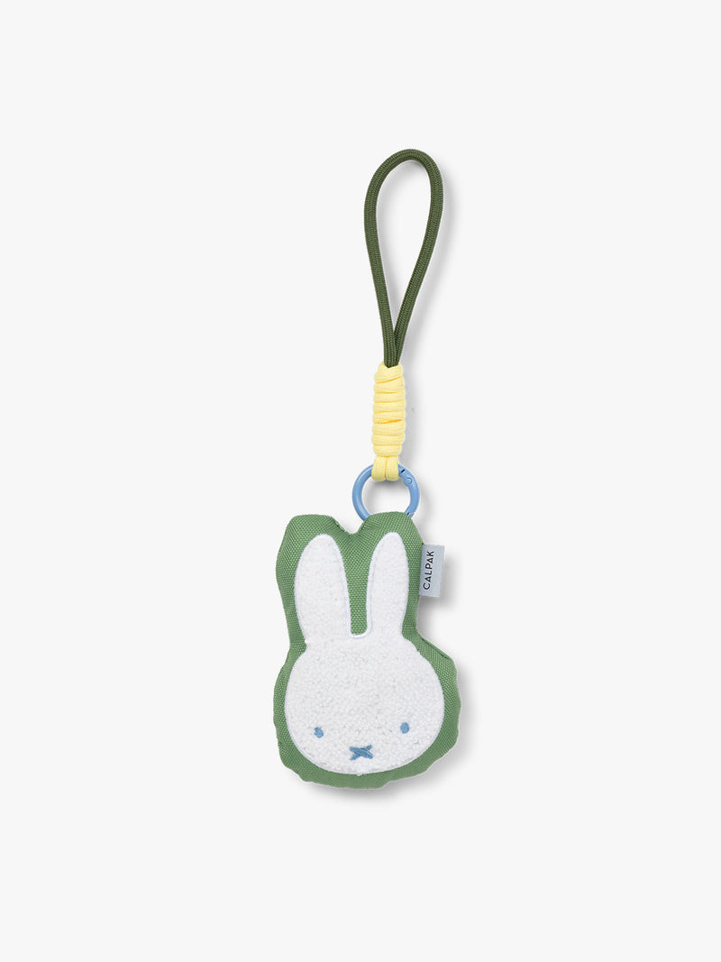 Plush Miffy x CALPAK Pluffy Bag Charm keychain with a green border and Miffy on a white background