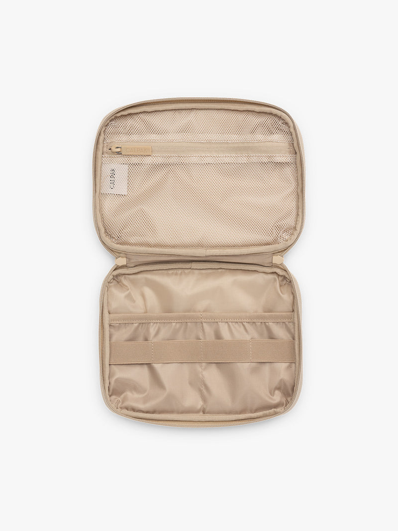 Inside view of CALPAK Tech Organizer in beige with cherry print in Oatmeal Blossom
