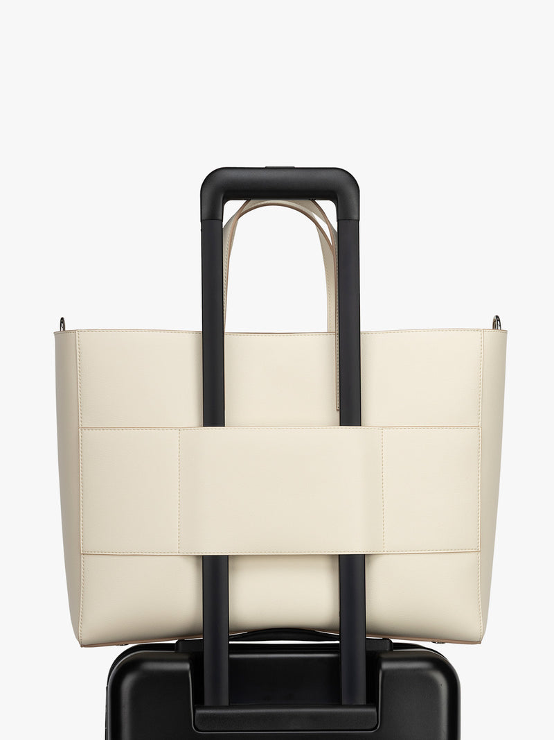 Trolley sleeve of CALPAK Haven 16" Laptop Tote in beige Buttercream