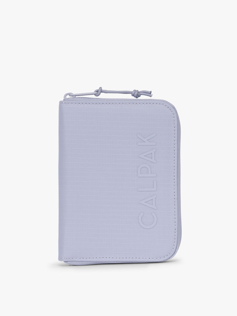 Front side of CALPAK Terra Zip Passport Wallet in light purple Sea Glass