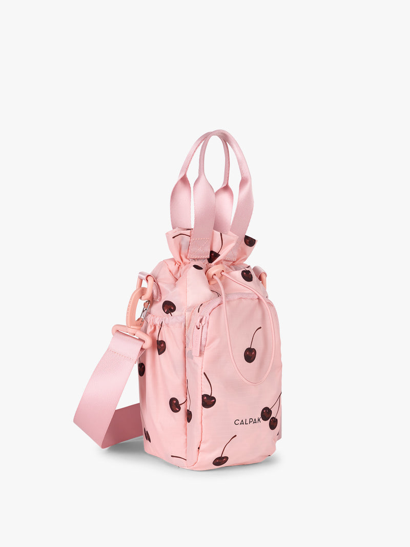 CALPAK Water Bottle Holder in Oatmeal Chery in pink with cherry pattern