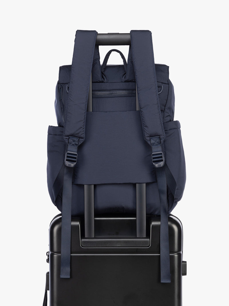 Luggage trolley sleeve of CALPAK Diaper Backpack in blue Navy