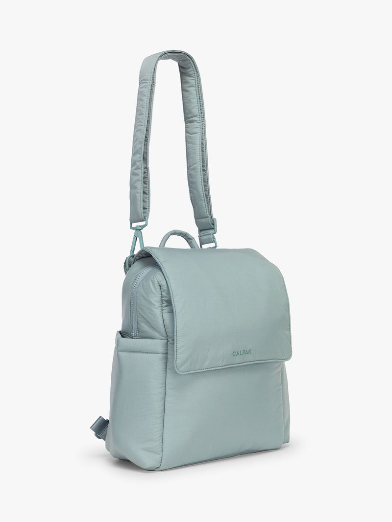 CALPAK Convertible Mini Diaper Backpack in light blue Bluebell side view with strap