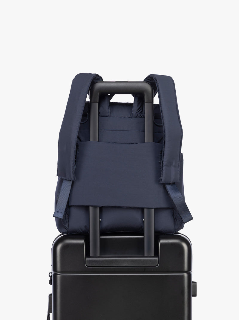 Luggage trolley sleeve of CALPAK Mini Diaper Backpack in blue Navy