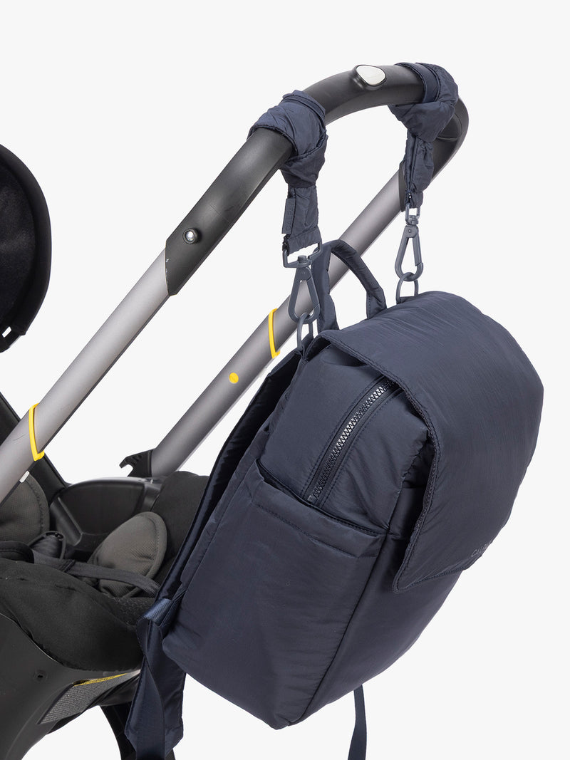 CALPAK Mini Diaper Backpack in blue Navy on stroller with stroller straps