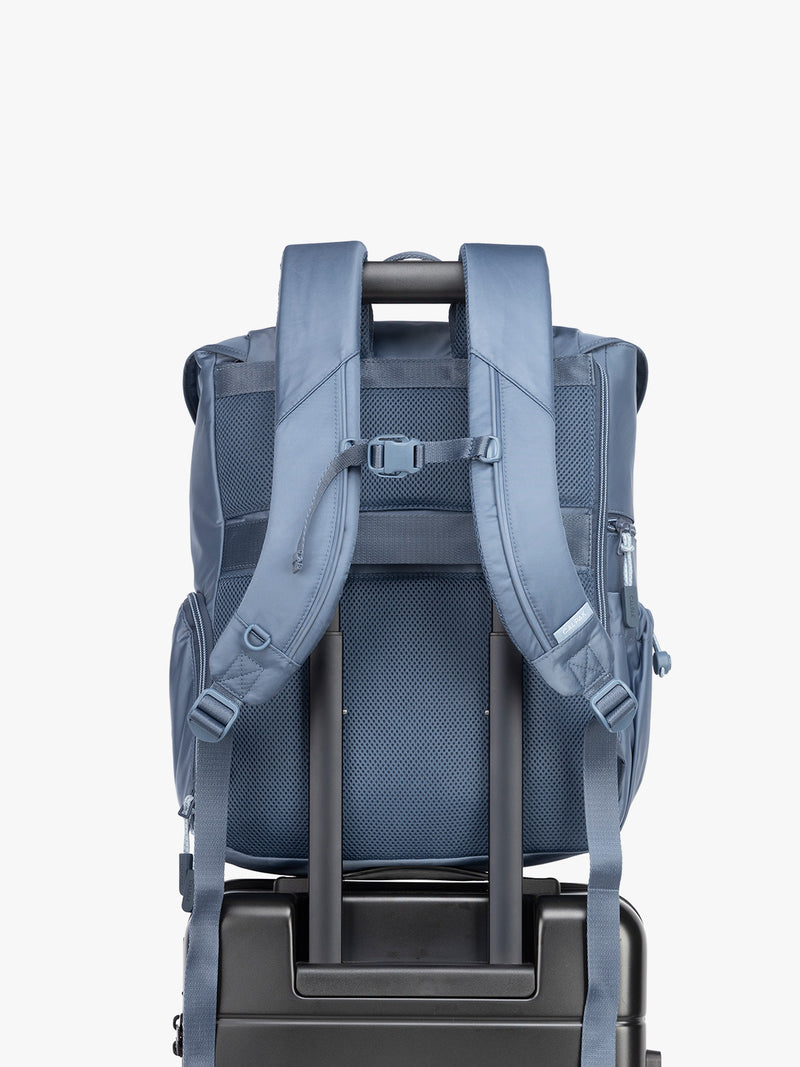 CALPAK Fit Gym Backpack in blue Indigo front view with trolley sleeve for luggage