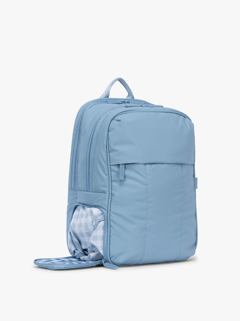 Side shoe compartment of the CALPAK Luka 15" Backpack in light blue French Blue