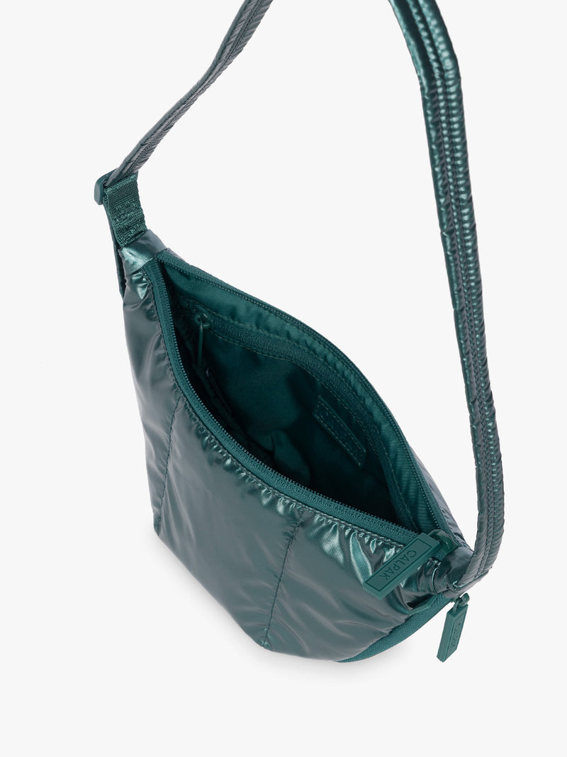Opened CALPAK Luka Crescent Bag in dark green shiny Kale