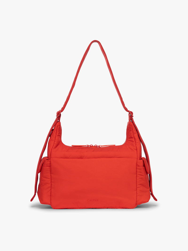 Backside of CALPAK Crossbody Diaper Bag in red Tomato