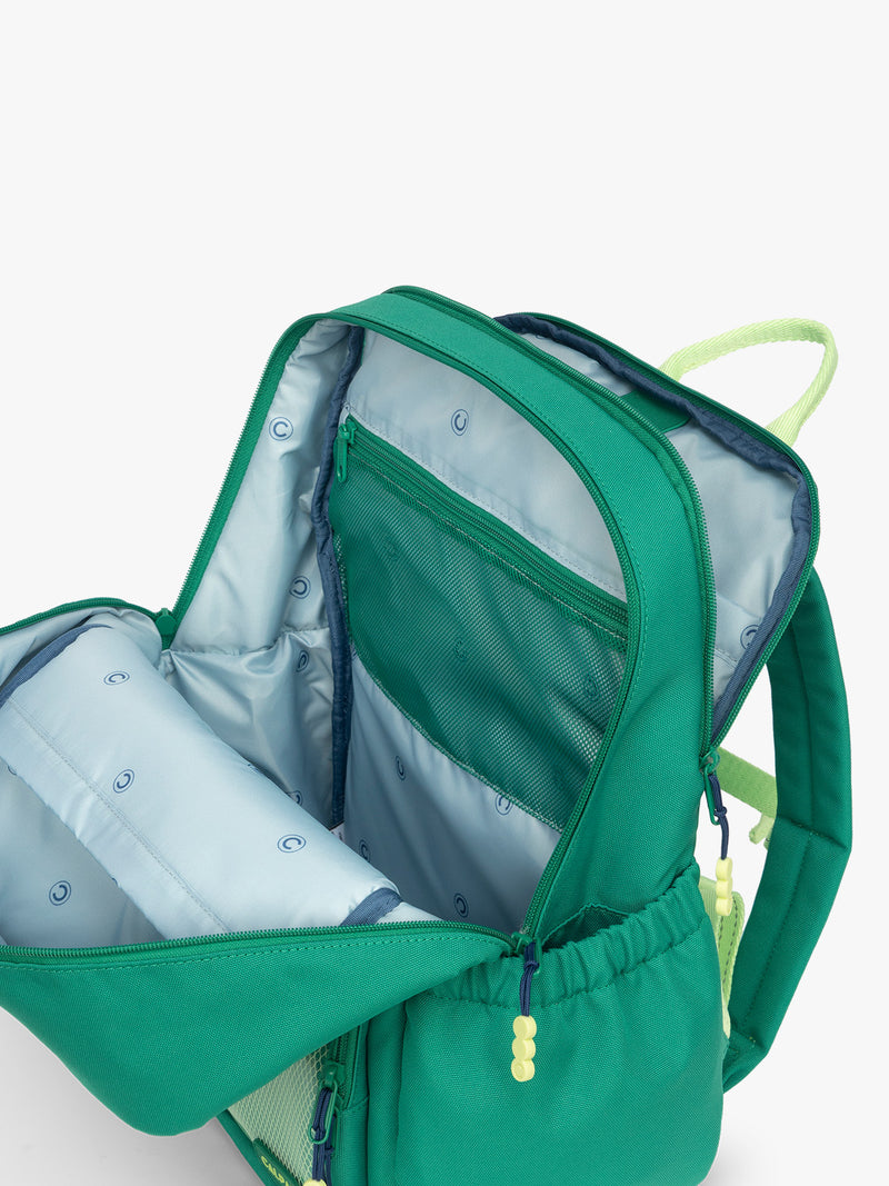 Opened view of the green CALPAK Kids Large Backpack with lime green accents on a white background