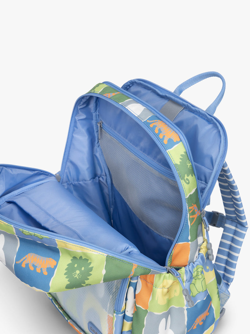 Opened pockets of CALPAK Kids Large Backpack with Miffy and blue colorful animal pattern on a white background