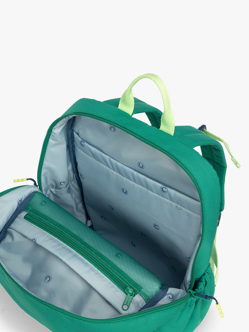 Opened view with blue interior of the Green CALPAK Kids Medium Backpack with lime green accents on a white background