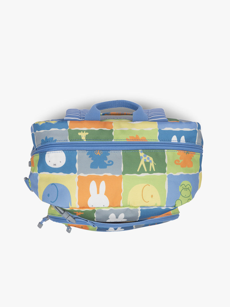 Top view of  CALPAK Kids Medium Backpack with Miffy and blue colorful animal pattern on a white background