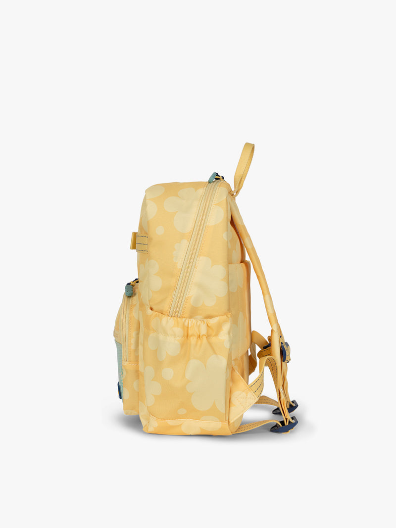 CALPAK Kids Small Backpack in yellow with tan flower print in Yellow Bloom for ages 3-5 side view with water bottle holder pocket