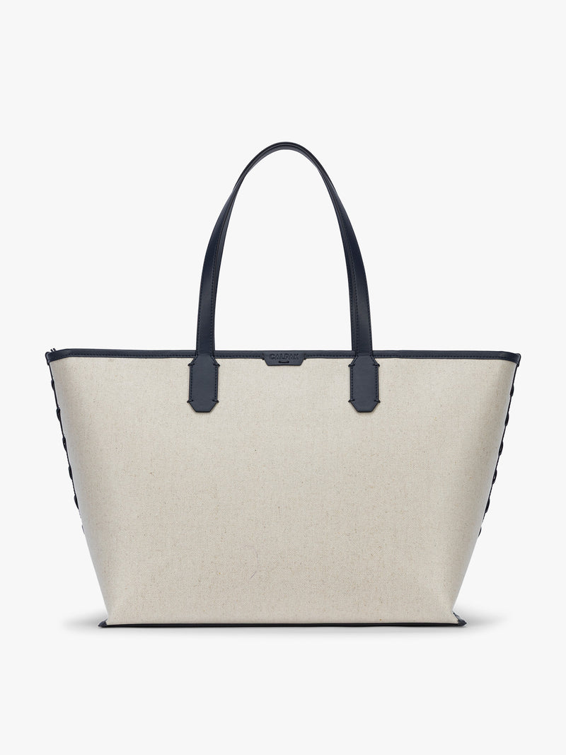 CALPAK Colette 15" Canvas Laptop Tote in beige canvas material  with blue finishing in Natural Navy