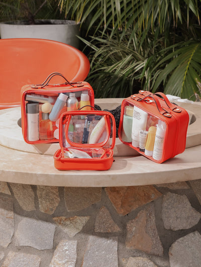 CALPAK Large clear makeup bag with zippered compartments in papaya; CCC2001-PAPAYA view 2