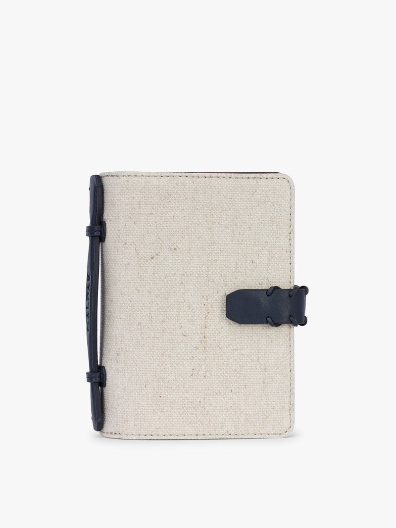 CALPAK Colette Multi Passport Wallet in beige canvas material and blue finishings in Natural Navy