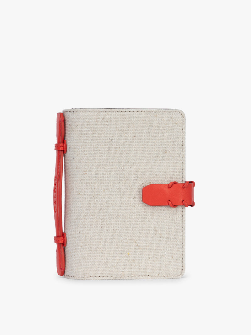 CALPAK Colette Multi Passport Wallet in beige canvas material and red finishings in Natural Tomato