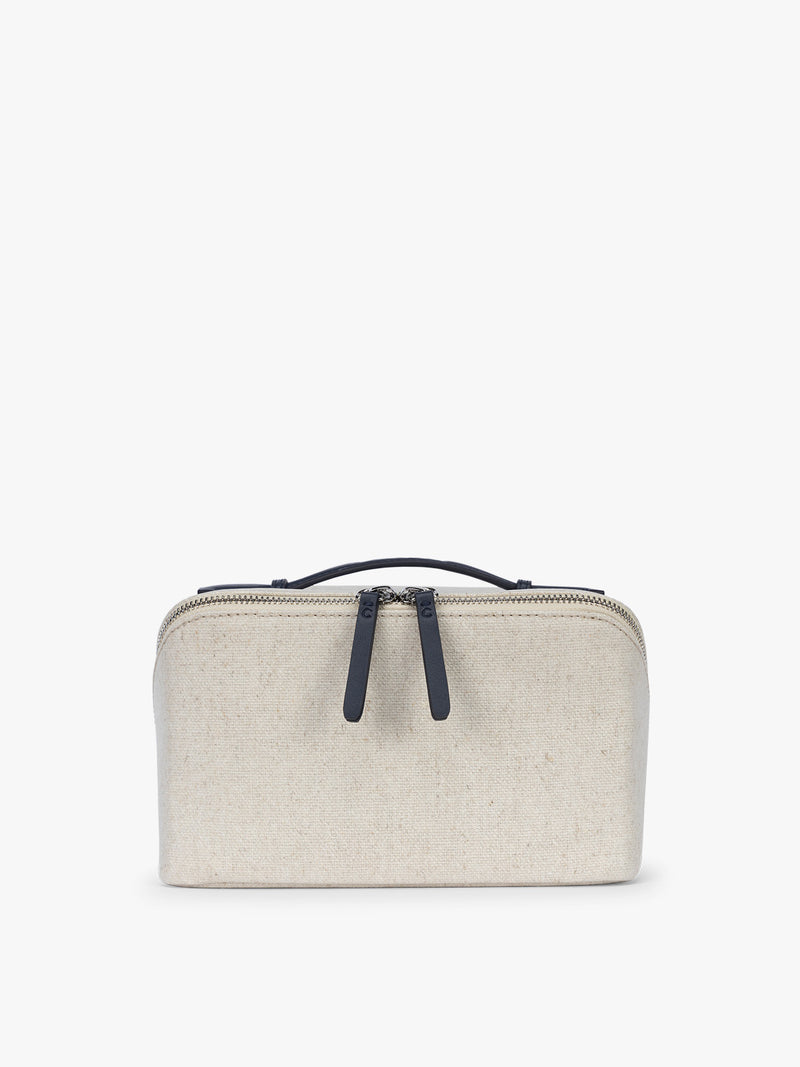 CALPAK Colette Lay-Flat Canvas Toiletry Bag in beige canvas material and blue finishing