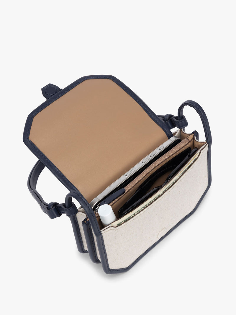 Opened CALPAK Colette Canvas Crossbody Wallet Bag in Natural Brown with beige canvas material and blue finishing