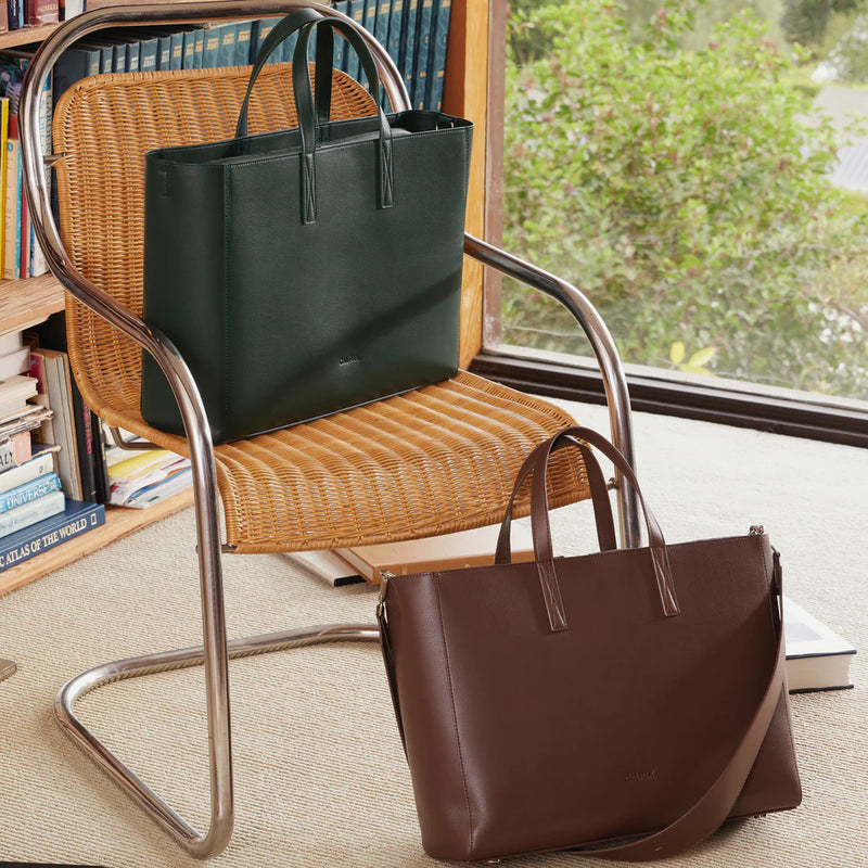 CALPAK Haven Tote Bags in an office in colors green Forest and Brown