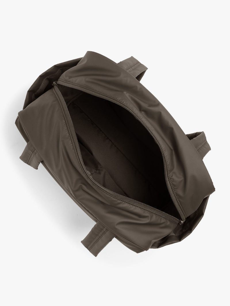 Opened CALPAK Luka Mini Duffel in brown Mushroom