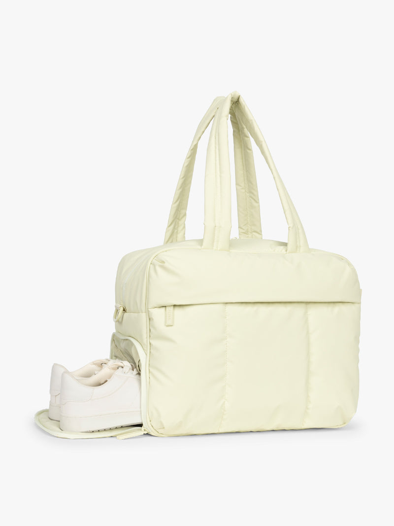 Shoe compartment of CALPAK Luka Duffel in light green Celadon