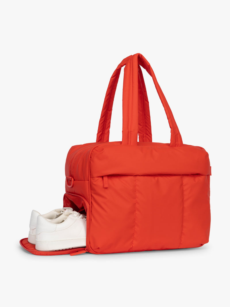 Shoe compartment of CALPAK Luka Duffel in red Tomato