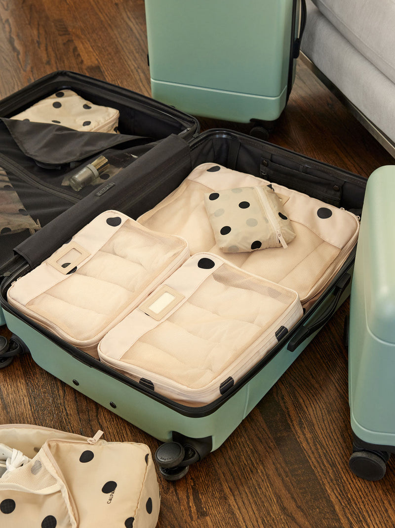 CALPAK large hard shell spinner luggage in light green jade; LHU1028-JADE