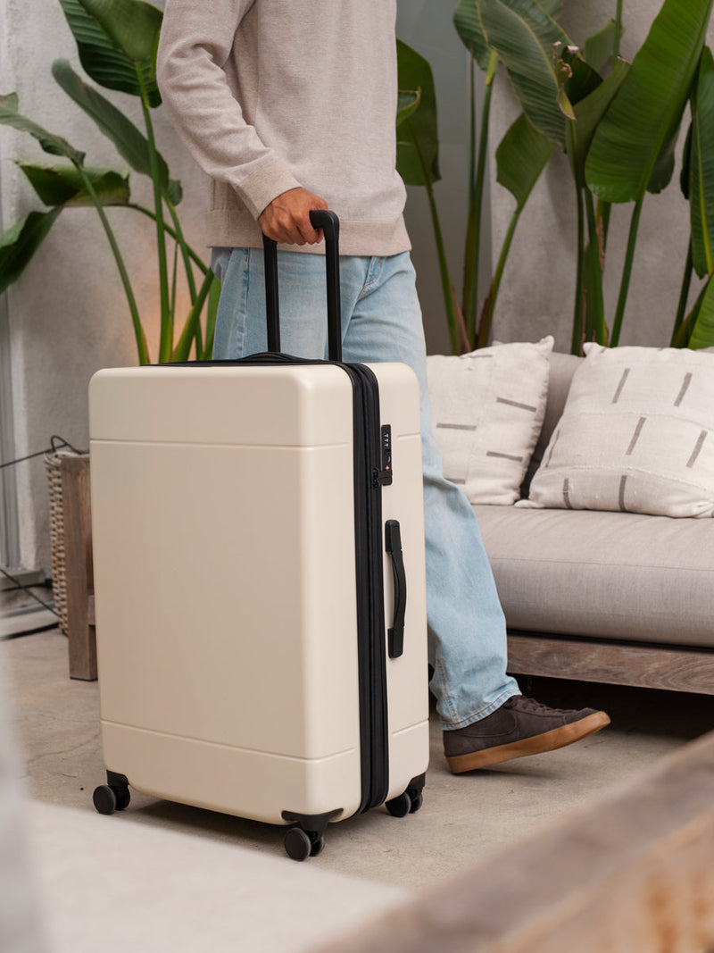 CALPAK Hue large 30 inch hard shell spinner suitcase in cream linen; LHU1028-LINEN