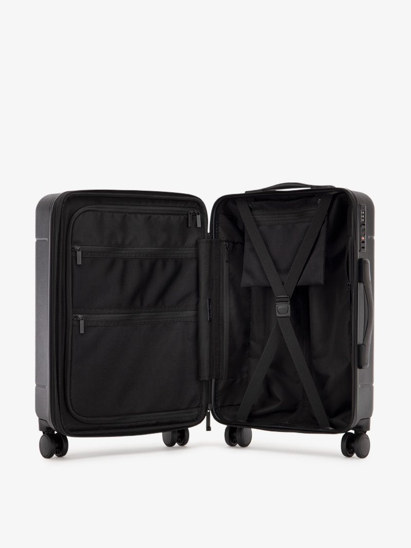 Opened CALPAK Hue Starter Bundle in Black with wheels on a white background