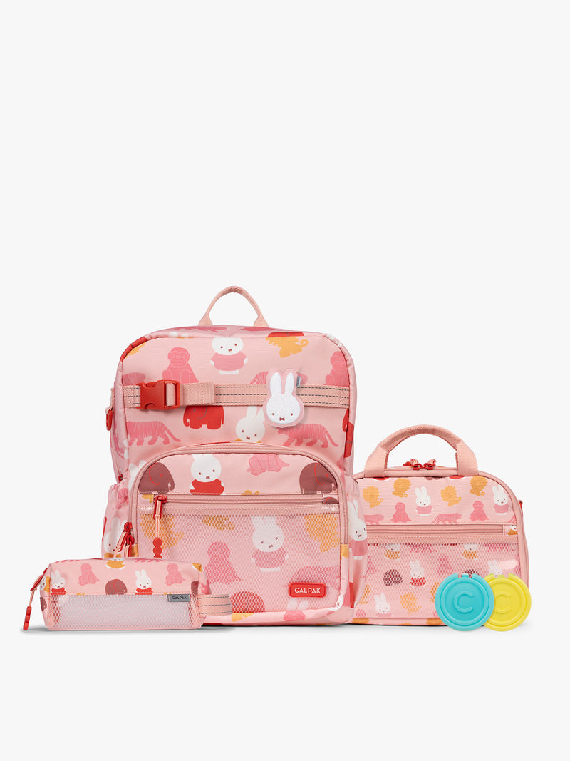 Colorful CALPAK + Miffy Kids Essentials Set with children's Medium backpack, lunch bag , pencil case set on a white background with pink accents and Miffy with other animals